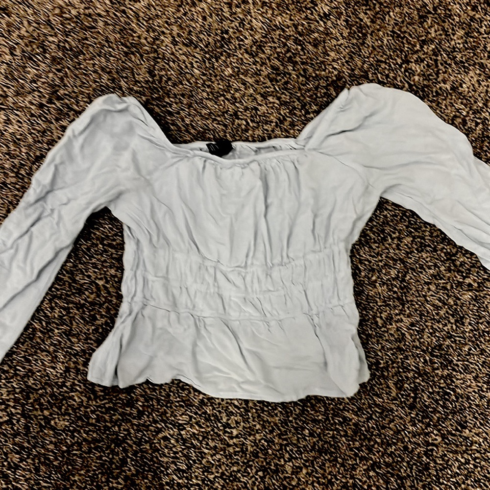 Light blue long sleeved shirt. Kids size large. Brand art class